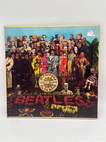 Front cover showing iconic collage artwork