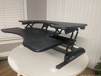 Side view showing raised position of Varidesk ProPlus 36 desk converter