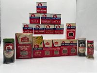 Group shot of all 16 Club House spice containers arranged in tiers