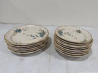 Two stacked columns of dinner plates showing quantity and edge detail
