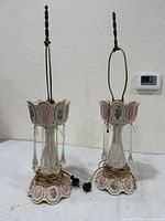 Front view of both lamps without shades showing bases, prisms and electrical cords