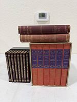 All books: boxed Shakespeare set, Webster’s volumes, two maroon shipbuilding books