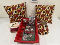 Overview of lot with pillows, cap, mug, tray of smaller items, lampshade