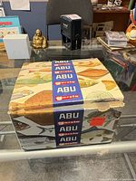 closed ABU Garcia fish-patterned box