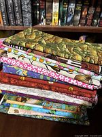 Stack showing variety of printed cotton half-yard pieces