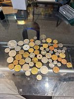 Overview of entire coin lot spread on tabletop