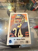 Front of oversized Walter Payton promotional card showing image, card number 34, player data, logos