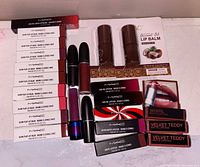 Group shot showing all boxed MAC lip products and coconut balm pack