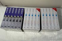 Front view of sealed Sony 6-pack and two Memorex 5-packs