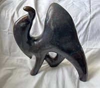 Front view of the glazed ceramic camel showing overall form and glaze