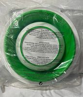 Front view showing green interior sealed in original plastic