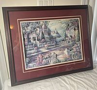 Full view of framed layered paper artwork on table