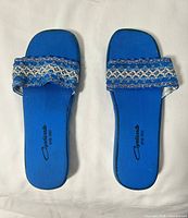 top view of both slippers showing uppers and branding
