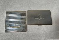 Front view of both metal card holders closed