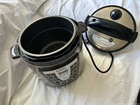 Open pressure cooker showing inner pot