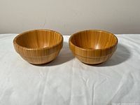 Two bamboo bowls side by side