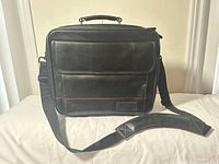 Full view of black Targus messenger bag with strap and handle visible