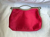 Front view of magenta clutch purse