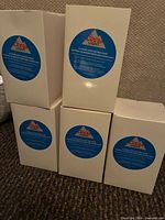 Five white boxes with Coors Light logo labels