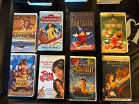 Front covers of eight Disney VHS tapes displayed