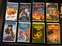 Front covers of all eight VHS cases laid out