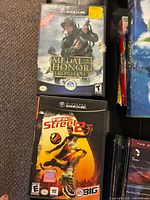 Front covers of Medal of Honor: Frontline and FIFA Street 2 cases