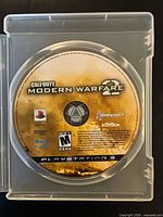 Disc in open case showing full label, Call of Duty: Modern Warfare 2 for PS3