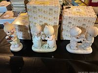 All three Precious Moments figurines with two original boxes