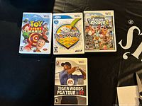 Front view showing four Wii game cases