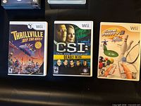 Front of the three Wii game cases