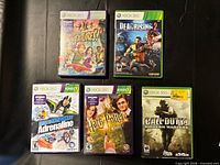 Front view of all five Xbox 360 games