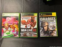 Front view of all three Xbox game cases