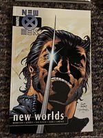 Front cover of New X-Men: New Worlds showing title and artwork