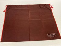 Full view of brown cloth Coach dust bag