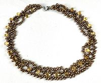 Full view of three-strand brown and citrine necklace