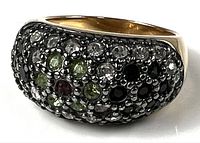 Oblique view of ring showing pavé cubic zirconia face and gold-tone shank