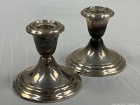 Two Gorham sterling candlesticks front view