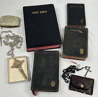 Group shot of all books, rosaries, crucifix, pouches