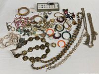 Full spread of assorted necklaces, bracelets, earrings, rings and bangles