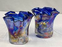 Front view of both Murano vases showing colours and fluted rims