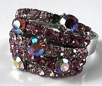 Front view showing clustered pink and iridescent stones on silver-tone setting