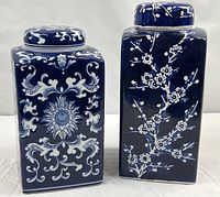 Both ceramic jars side by side with lids