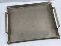 Full view of aluminum tray showing overall form and handles