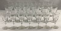 Full set of 19 Libbey Candlelight glasses arranged in rows