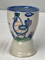 Front view showing chicken scene and overall form