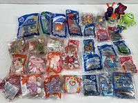 Full lot overview showing sealed bags and loose figures