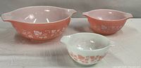 Three Pyrex Gooseberry bowls showing size and colour difference