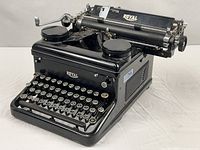 Three-quarter view of Royal Model O typewriter showing overall body and keys