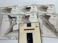 Front view of seven unopened pantyhose packages