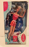 Front of sealed Barbie Coca-Cola Splash Special Edition box showing doll and accessories